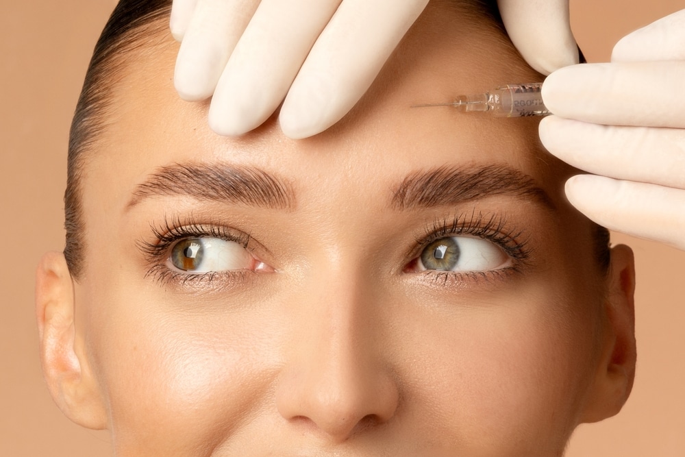 29-year-old woman with smooth forehead gets preventative Botox.